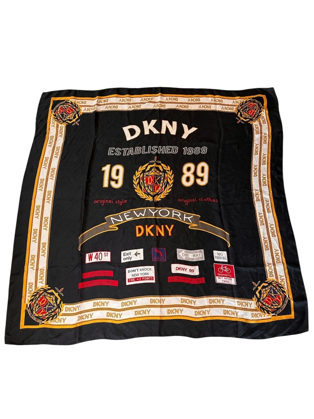 Vintage DKNY black silk scarf / wrap with NYC street sign & crest print
42”